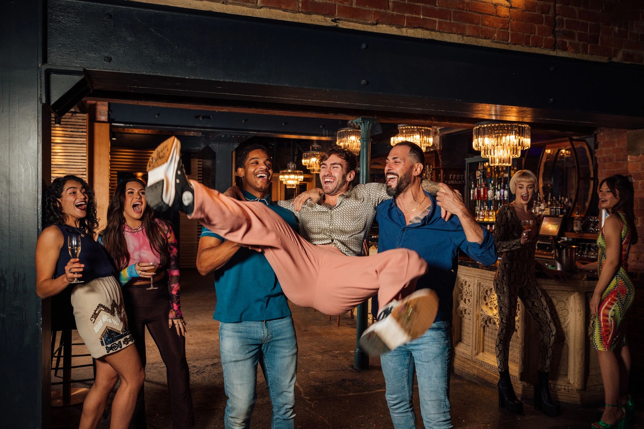 Group of friends celebrating together at night