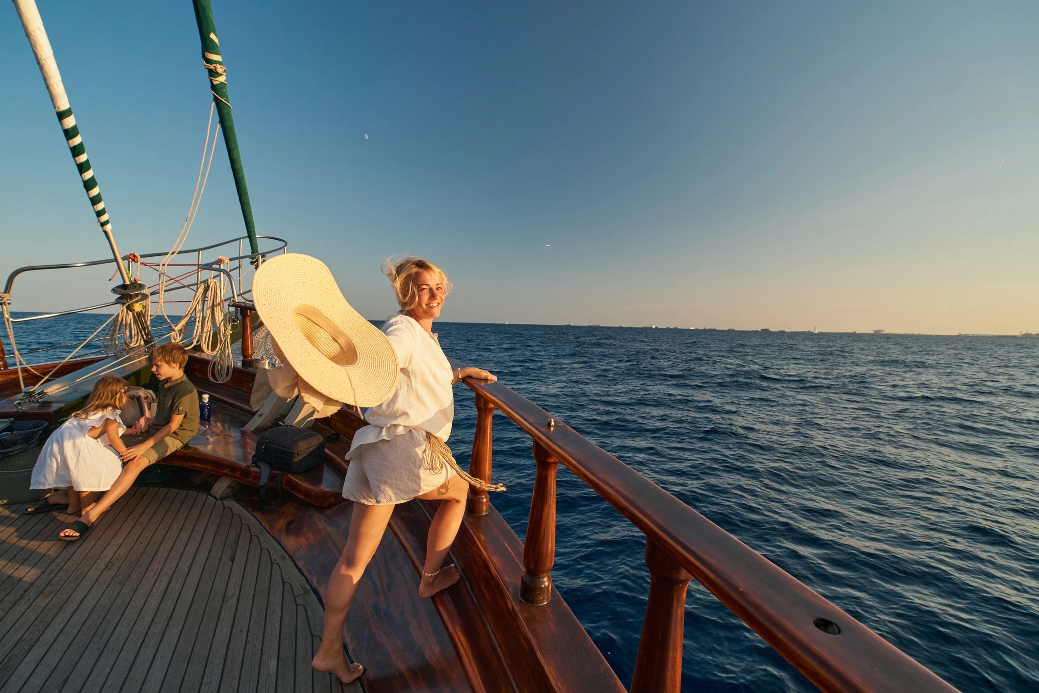 Guests enjoying a boat trip at sunset