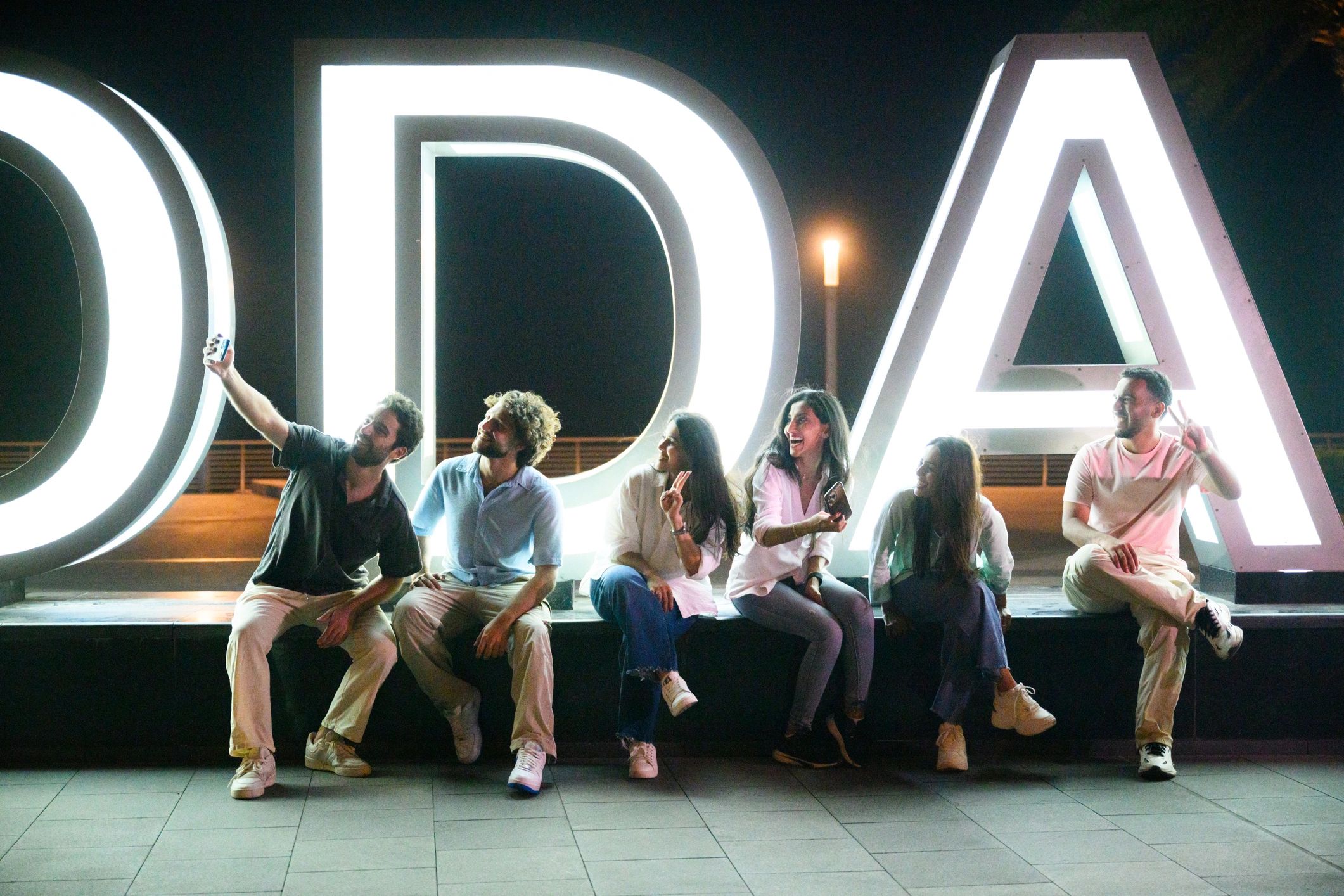 Group of friends enjoying a waterfront night out